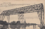 Gruss aus Osten,Die jetzt fertiggestellte und im Betrieb befindliche Elektrische Schwebefähre,80m breit und 33m hoch,gel. 1909